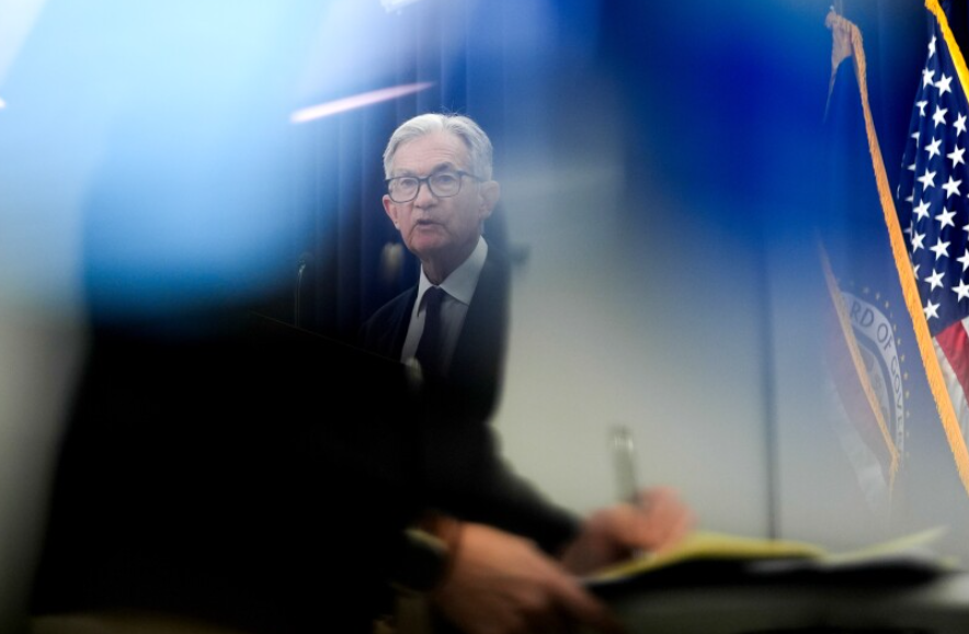 Jerome Powell at Federal Reserve meeting discussing rate cuts