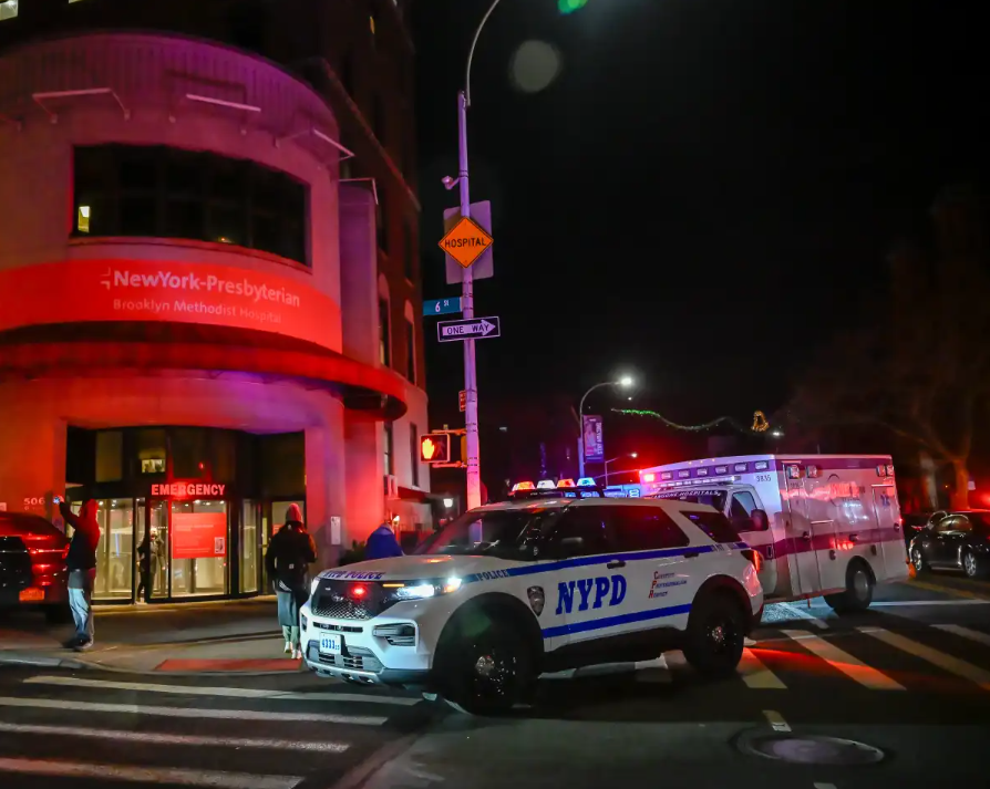 Police and emergency vehicles at night crime scene in New York City