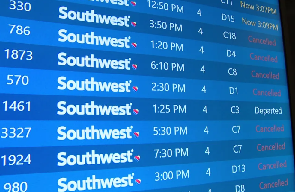 Southwest Airlines flight board showing massive delays and cancellations