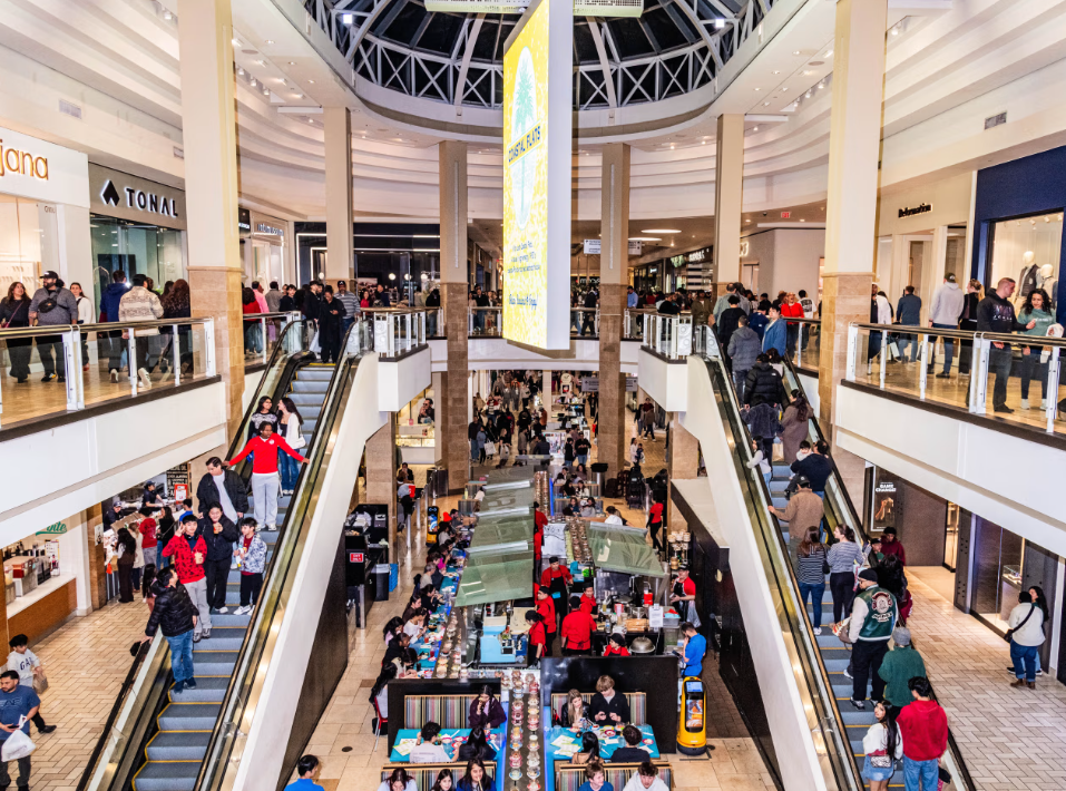 Crowded shopping mall interior with shoppers before active shooter incident