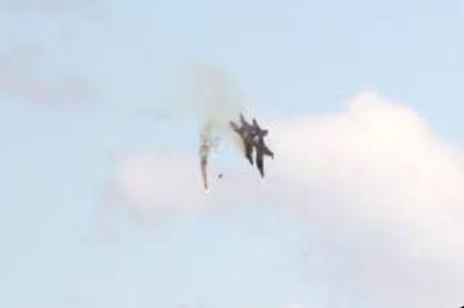 Two US fighter jets colliding mid-air during Idaho air show with smoke and debris
