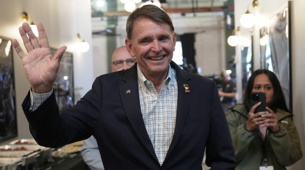 Ed Gallrein waving at victory event after winning Kentucky GOP primary