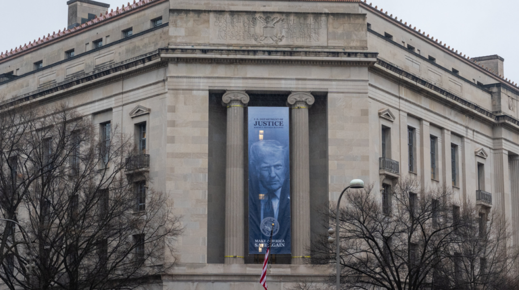 U.S. Department of Justice headquarters building in Washington DC with banner