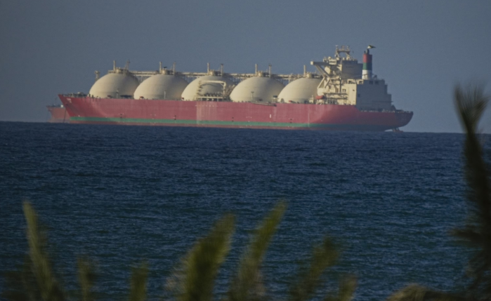 Oil tankers and cargo ships in the Strait of Hormuz as a US-Iran deal approaches to reopen the critical waterway in 2026