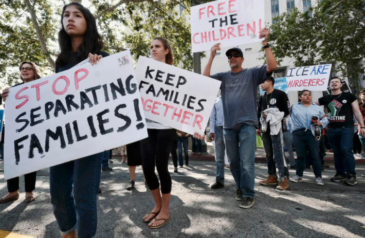 Immigrants and advocates protesting Trump administration immigration policies in 2026

