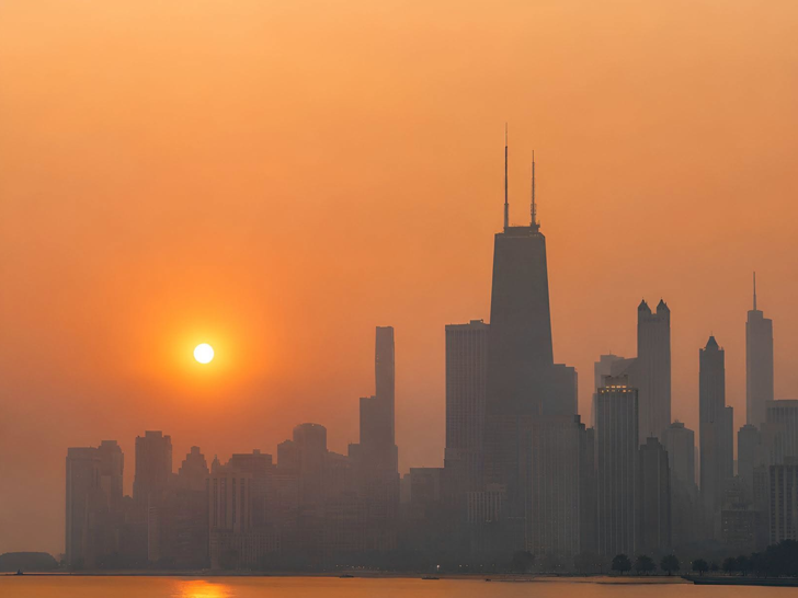 Hazy smoke-filled sky over city during wildfire smoke event