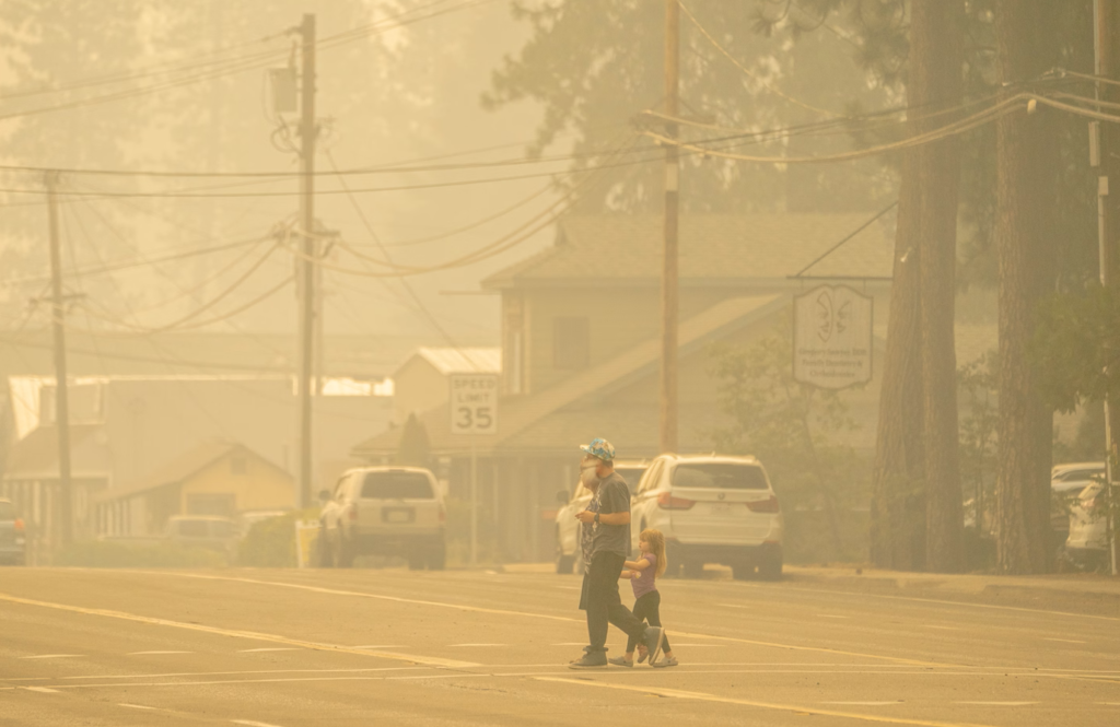 Child wearing protective face mask outdoors